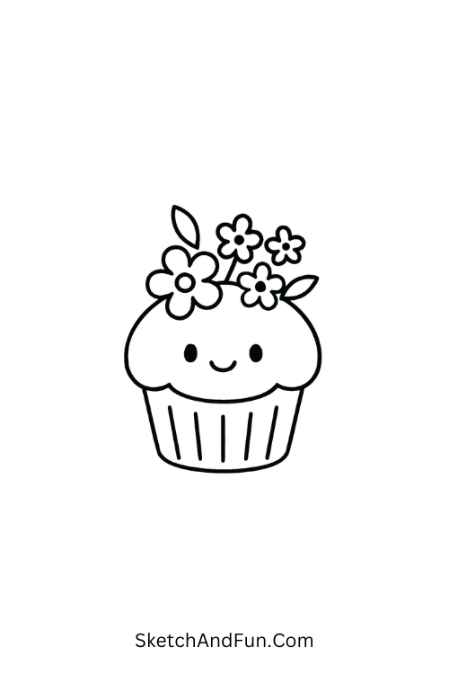A cupcake decorated with flowers and a cheerful face, April themed art ideas