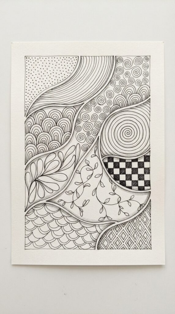 Beginner Zentangle art setup with pen, paper, pencil, eraser, and ruler