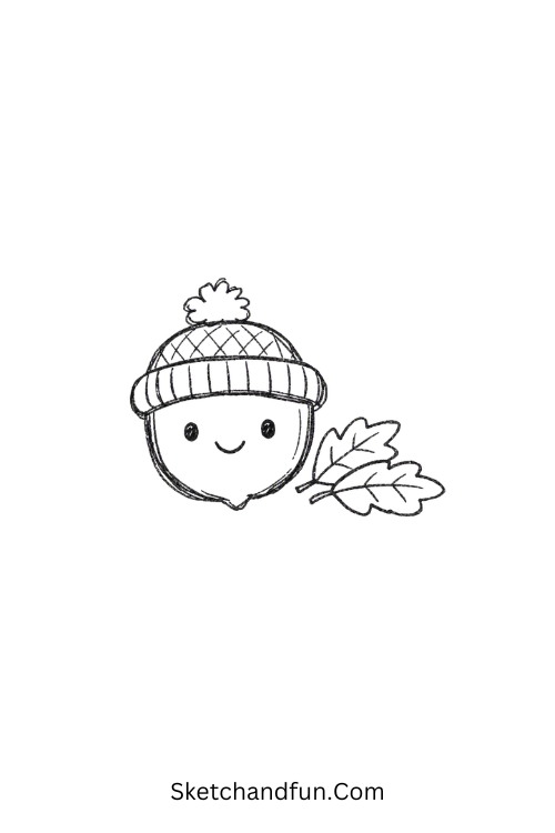 October Acorn Drawing with a tiny knitted hat and leaves