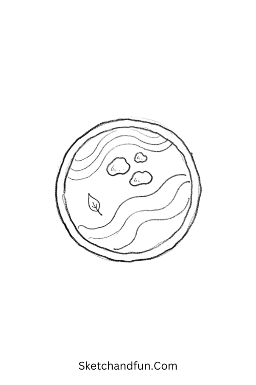 Tiny Zen garden with curved sand lines and pebbles