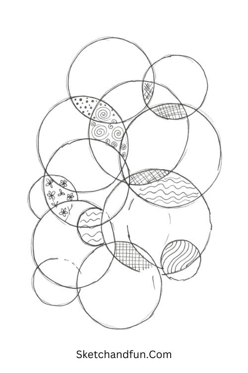 Zentangle interlocking circles filled with overlapping sections, dots, waves, loops, and geometric motifs