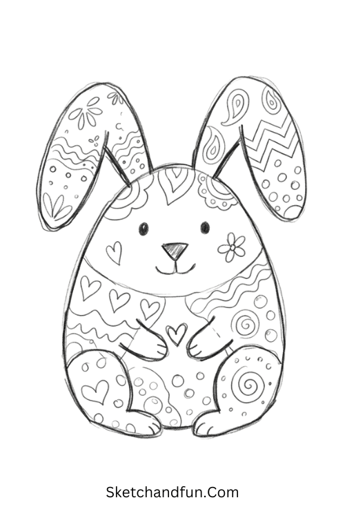 Zentangle rabbit drawing with patterned ears and body featuring flowers, paisleys, waves, and geometric motifs